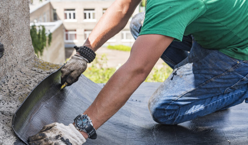 worker-performs-overhaul-roof-residential-building